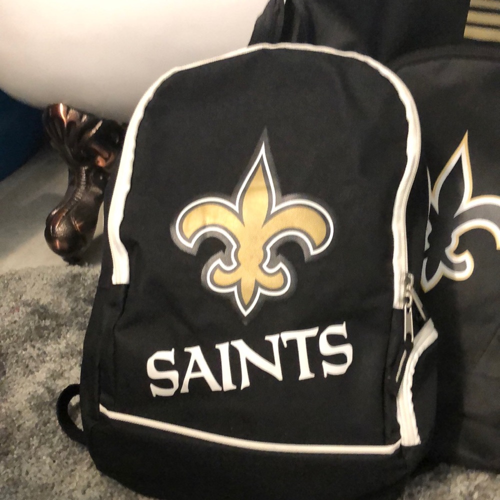 Small NewOrleans Saints backpack. Pictured by regular size backpack 4 show size.